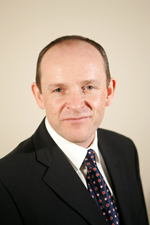 A portrait photo of Dr Tom Gilhooly
