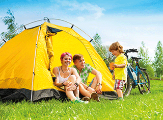 A photo of a family with a tent