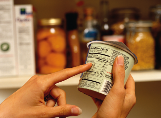 Checking ingredients on a carton