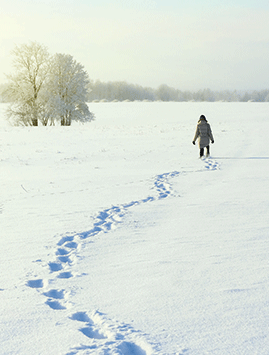 A woman walking in the snow