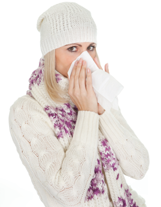 A photo of a woman blowing her nose