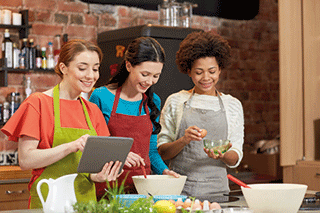 Some young women in a kitchen