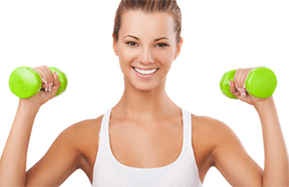 A photo of a young woman exercising with free weights